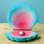 Bumbu wooden toy Clam Shell with a shiny Pearl, in striking blue and pink colours.