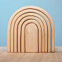 Bumbu Natural Wooden Stacking Arches. The toy sits on a wooden surface against a blue background.