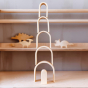 Bumbu Natural Wooden Stacking Arches. The arches are stacked in a home setting.