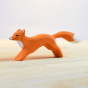 Bumbu eco-friendly wooden running fox toy figure on a cream wooden work top in front of a white background