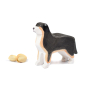 Bumbu plastic free wooden berna sheepdog figure stood on a white background next to some pistachio nuts