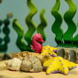 Bumbu Yellow Starfish Set posed with the Bumbu Seahorse and Seaweed wooden toys.