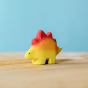 Bumbu wooden Stegosaurus baby with a yellow body and red back scales