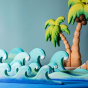 Bumbu Wooden Waves. The toy is paired with a palm tree.