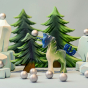 Bumbu Small and Large Fir Trees make an excellent backdrop for a winter wonderland scene. In front of the Fir Trees is a mystical Bumbu Unicorn, icy rocks and small silver balls, on a pale background