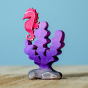 Bumbu wooden Purple Seaweed toy, posed with the Bumbu wooden seahorse.