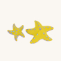Bumbu Handmade Wooden Yellow Starfish Set. Beautifully hand painted star fish in yellow with light blue and purple spots, on a cream background