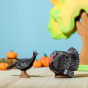 Bumbu Hen and Stag turkey in Thanksgiving play scene with pumpkins.
