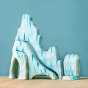 The Bumbu Icy Cliffs is a set of 5 handmade wooden blocks that stack together to make an icy mountain scene. Hand carved and painted in shades of white and blue to represent glaciers, steep icy cliffs, icebergs, icy caves and ravines.