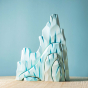 The Bumbu Icy Cliffs is a set of 5 handmade wooden blocks that stack together to make an icy mountain scene. Hand carved and painted in shades of white and blue to represent glaciers, steep icy cliffs, icebergs, icy caves and ravines.