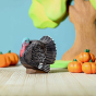 The Bumbu Turkey is a magnificent eco-friendly wooden male turkey toy, in a Thanksgiving play scene with pumpkins.