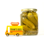 Candylab kids wooden hot dog truck toy on a white background next to a jar of pickles