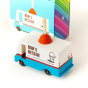Close up of the Candylab kids collectable plumbing van toy on a white background next to its cardboard packaging