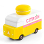 Picture of the Citron Candylab Candyvan. It is a 1960s style yellow and white van with a yellow Lemon Macaron on the roof.