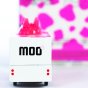 A closer look at the back of the Candylab Candyvan Strawberry Moo Milkshake Van. A white van with pink strawberry milkshake splashes with a soft squishy udder on top, and the word "Moo" written on the back with a small pink painted strawberry