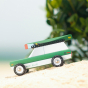 Picture of the magnetic wooden canoe boat toy attached to a Candylab Big Sur toy car.