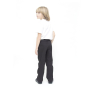 A child wearing Eco Outfitters GOTS organic cotton school uniform trousers - boys slim fit in black, with a white polo shirt and black shoes, facing away from the camera, looking over their shoulder. White background