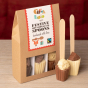 Cocoa Loco fairtrade hot chocolate spoons Christmas gift box on a wooden table next to a red background