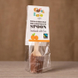 Cocoa Loco organic Fairtrade milk chocolate and orange hot chocolate spoon on a wooden table