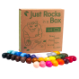 Crayon Rocks non-toxic soy wax crayons laid out on a white background in front of their box 