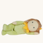 Olli Ella Dinky Dinkum Blossom Buds - Sunny Sunflower, lying down showing long light brown hair with a yellow hair clip
