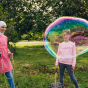 people making giant bubbles outdoors using the metal Dr zigs bucket