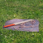 Dr Zigs Multi-Loop Bubble Wand with red handles and multi-loop bubble rope on a slate in the grass