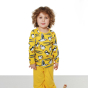 Child stood on a white background wearing the organic cotton DUNS Sweden yellow puffin long sleeve top