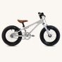 Side of the Early rider childrens aluminium belter bike on a beige background