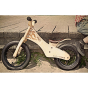 Retro graphic showing the Early Rider wooden classic balance bike leaning against a wooden deck