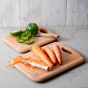 Carrots and peppers on top of Ecoliving Beech chopping boards on a grey worktop
