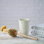 Ecoliving Small Wooden Toilet Brush pictured next to cream metal holder