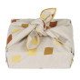 Christmas gift wrapped in the reusable organic cotton Fabelab diamond present wrap on a white background