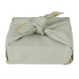 Box wrapped in the Fabelab reusable light green organic cotton Christmas gift wrap on a white background