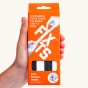 Close up of hand holding an 8 pack of FixIts mouldable fixing strips on a beige background