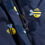 Zip detail on the jacket of the Frugi Waterproof All-In-One Suit - Buzzy Bee.