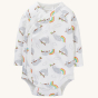 The Frugi Sleepy Sloths Shay Body cotton kimono style baby bodysuits with long sleeve and a white body, with a cute all-over sloth and rainbow print on a cream background