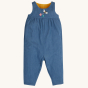 Frugi Chambray Bumblebee yellow Daisies Gracie Reversible Dungaree showing front of the chambray side pictured on a plain background