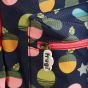 Pattern and zip detail on the Frugi Explorers Backpack - Acorns / Honeysuckle.