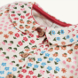 Collar and pattern detail on the Frugi Marta Dress - Floral Fun against a plain background.