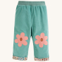 Moss wearable option of the Frugi Tess Cord Reversible Trousers - Moss / Floral Fun against a plain background.