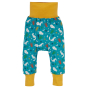 Kids Frugi parsnip pants with the cuffs unfolded on a white background