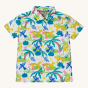 Frugi Organic Harvey Hawaiian Shirt - Jaguar Jungle. A bright and colourful print featuring lush jungle foliage, jaguars and parrots, with wooden button down the front and collar, on a cream background