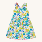 Frugi Organic Seraphina Dress - Jaguar Jungle. A soft and lightweight organic cotton, sleeveless poplin dress in a colourful Jaguar Jungle print with adjustable cross-over straps and button fastenings at the back. On a cream background