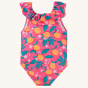 The back of the Frugi Amelia Swimsuit - Orange Blossom swimsuit made with Recycled material and soft lining with ruffle detail. A fun orange blossom print on pink material, on a cream background.