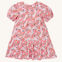 The back of the Frugi GOTS organic cotton Matilda Collared Dress - Pink Floral Fun. A playful spring-time print of white and red flowers, bees and ladybirds on a light pink fabric. The dress is a Tiered Dress with oversized peter pan collar and puff sleev