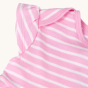 A close up view on the shoulder detail of the Frugi Bobby Dress - Jellyfish Breton / Rabbit. Made with GOTS Organic Cotton, this is a cheerful pink and white stripe dress, with a rabbit, daffodil and white daisy flower applique on the bottom of the dress,