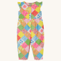 Frugi Children's Organic Cotton Etta Play-suit - Patchwork. A bright and colourful patchwork play-suit with beautiful flower print in patchwork squares, on a cream background.