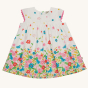 Frugi Soft White Flowers Elowen Dress pictured on a plain background