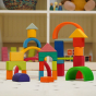 Glückskäfer 27 Piece Building Blocks Set pictured in a playroom alongside the Grimm's 6 piece rainbow